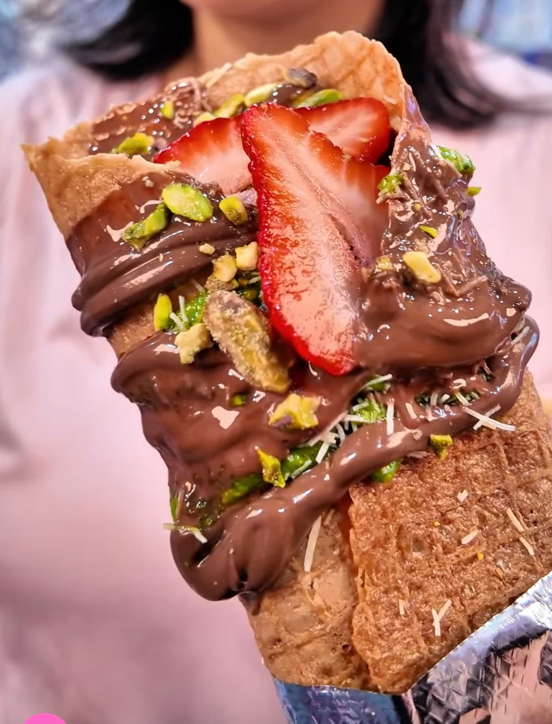 Marquesita with Nutella, strawberries and pistachios